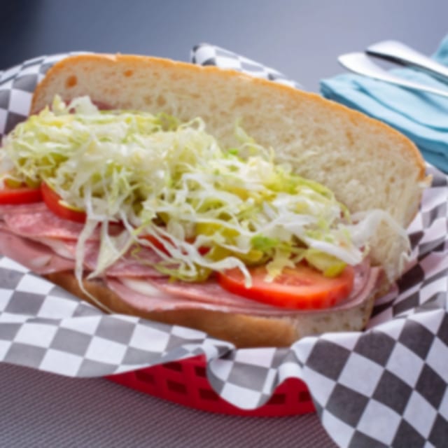 7. Salami, Mortadella, Provolone, Pepperoncini, Lettuce, Tomato, Italian Dressing Sandwich.