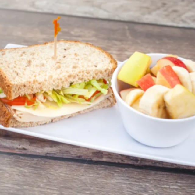 HH - Half Turkey Sandwich & Fruit Cup.